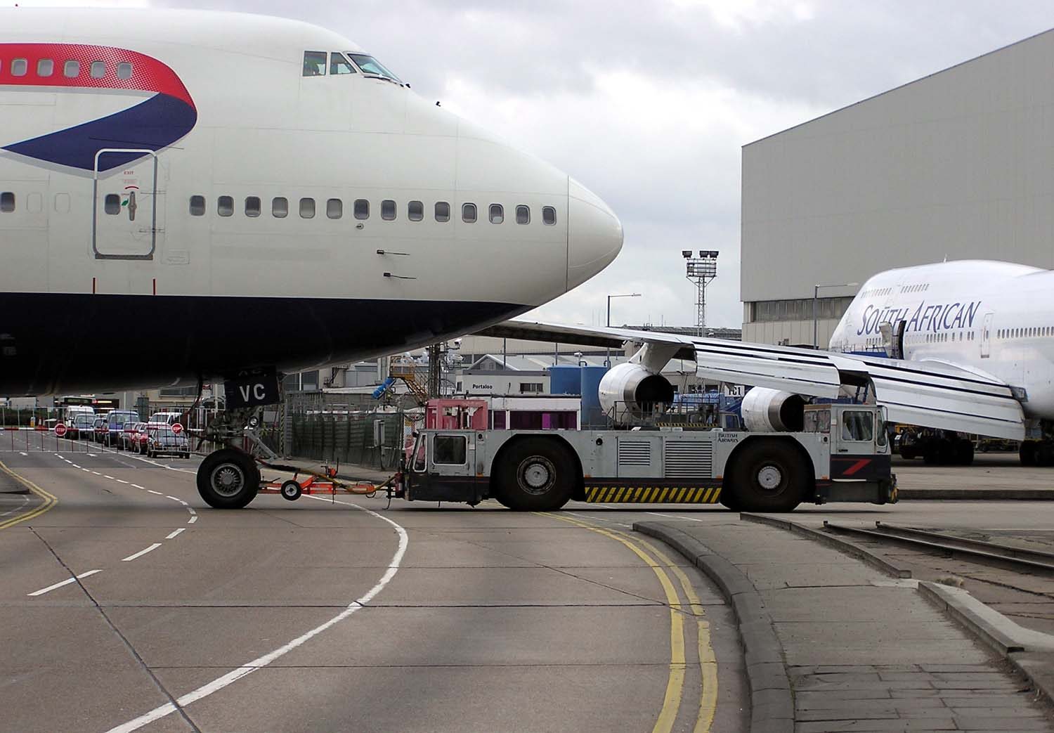 Ground handling equipment around an airliner on the apron